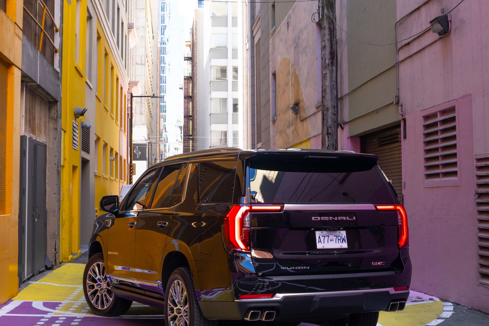 The Yukon Denali from behind in the painted alley