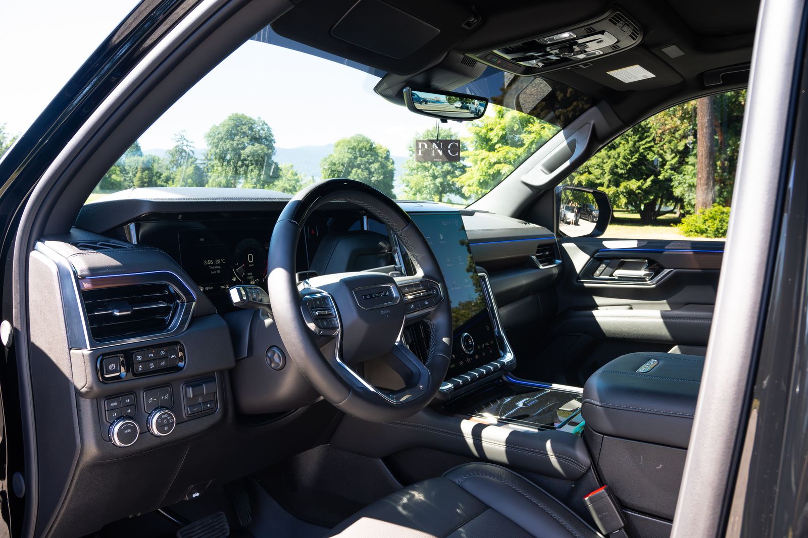 The Yukon Denali's cockpit through the driver's door
